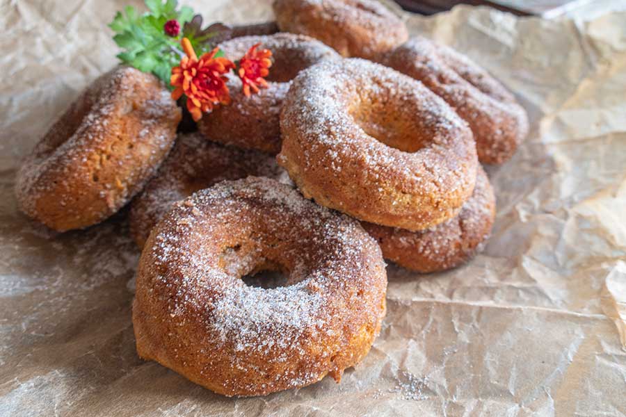 close up of 4 apple cider donuts, gluten free