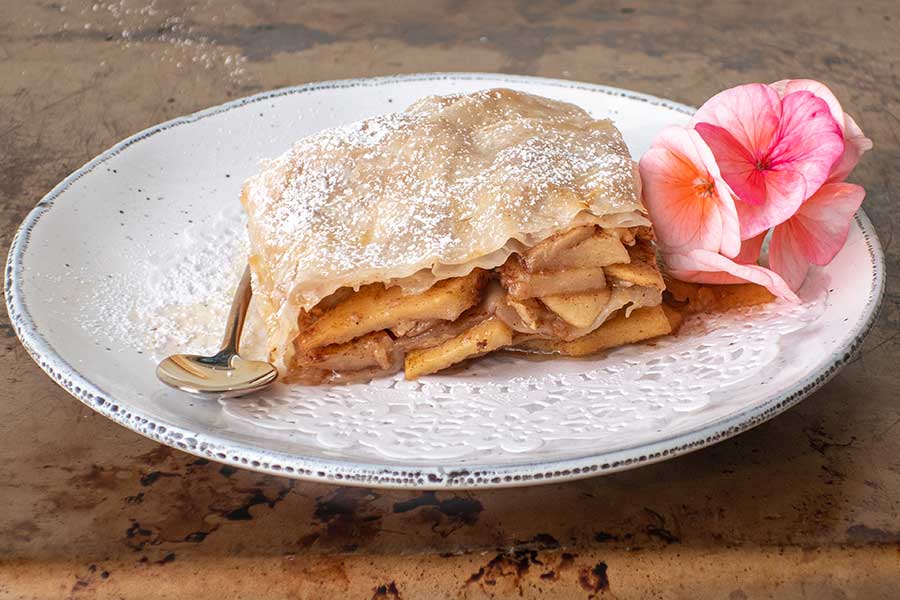 close up image of apple strudel on a plate