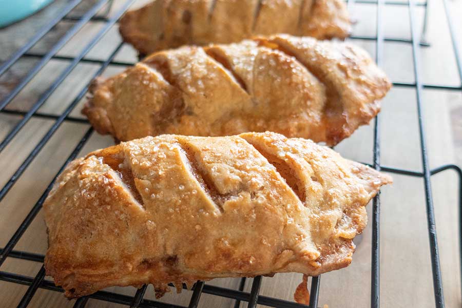 baked gluten-free apple turnovers on a cooling rack