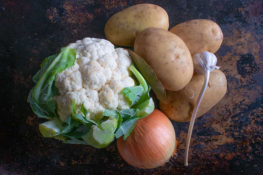 fresh cauliflower, potatoes, garlic and onion