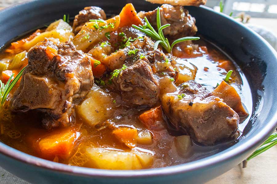 oxtail soup, in a bowl