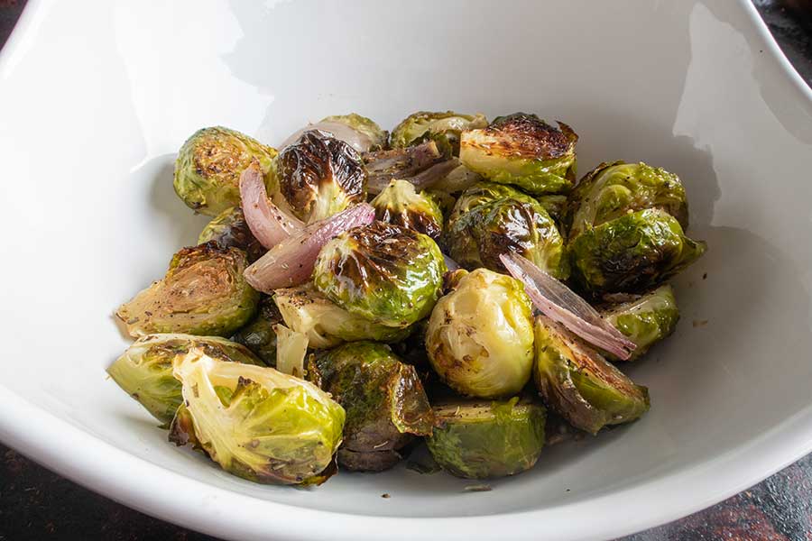 roasted brussel sprouts with shallots in a bowl