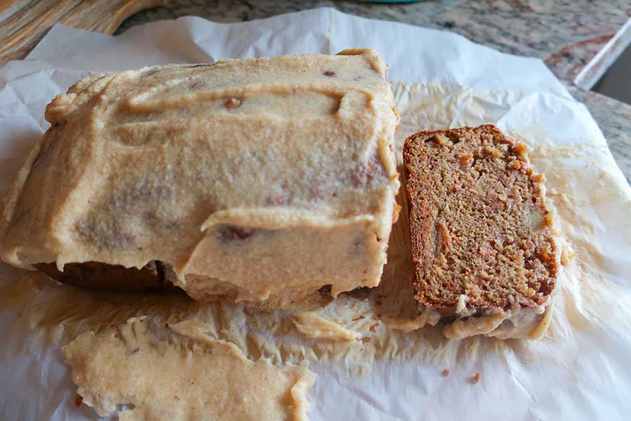 sliced apple carrot loaf with frosting