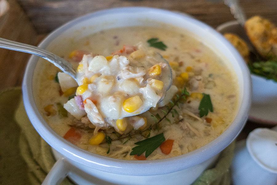 clam chowder in a bowl with a spoon, fall soup