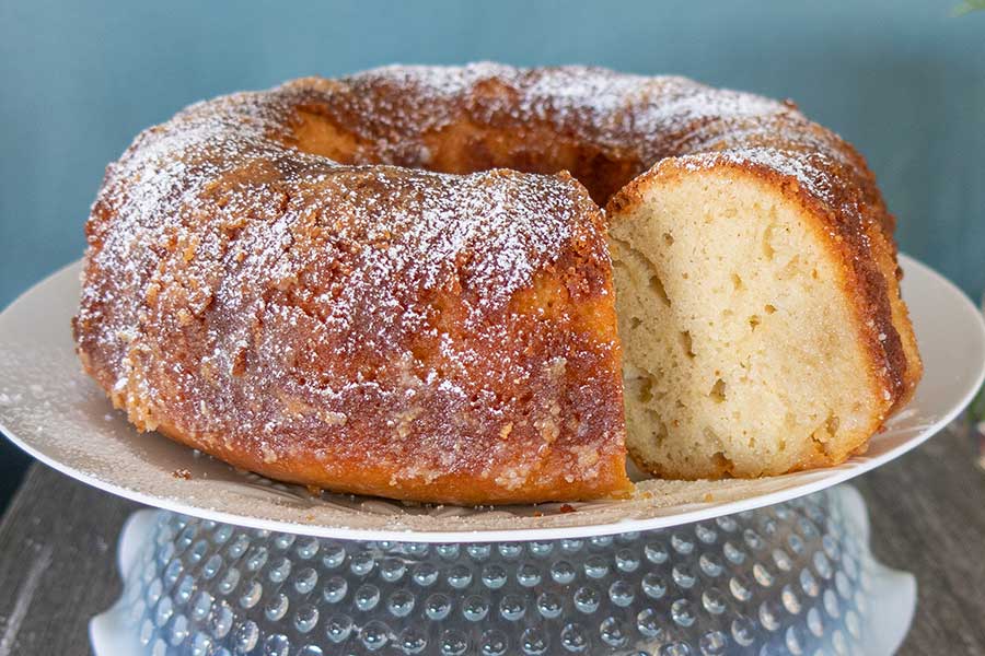 caribbean rum cake on a cake platter, gluten free