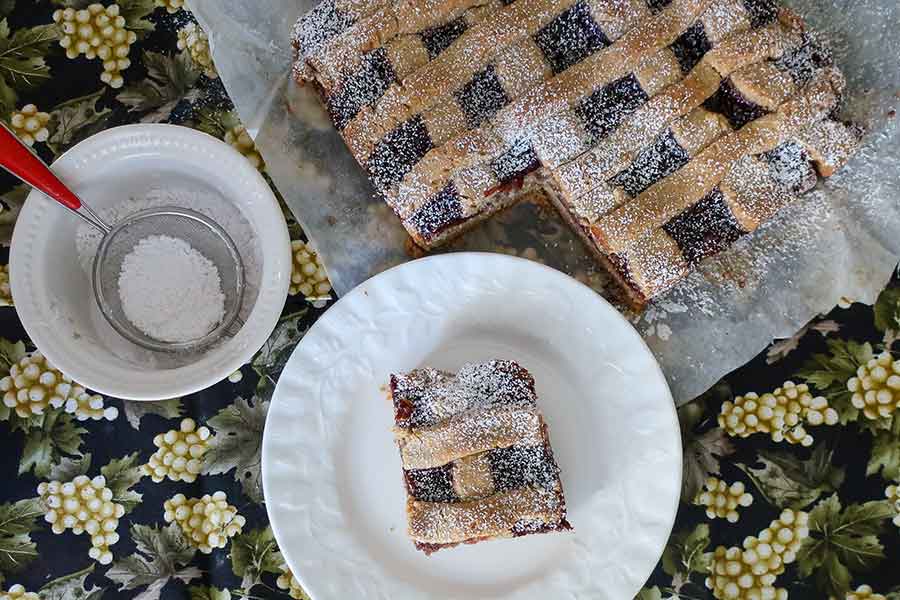 a slice of raspberry linzer Holiday cake, gluten free