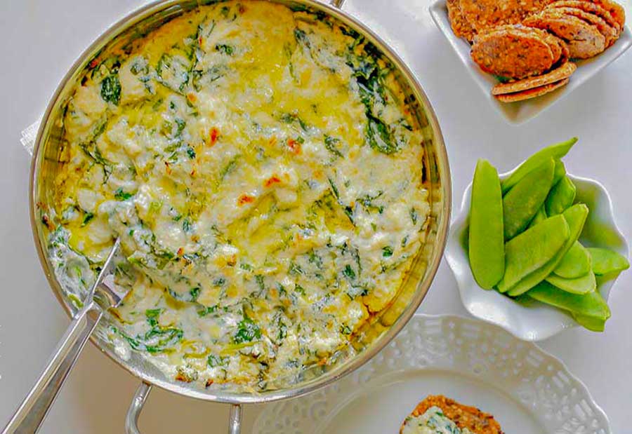 hot spinach ricotta dip in a bowl