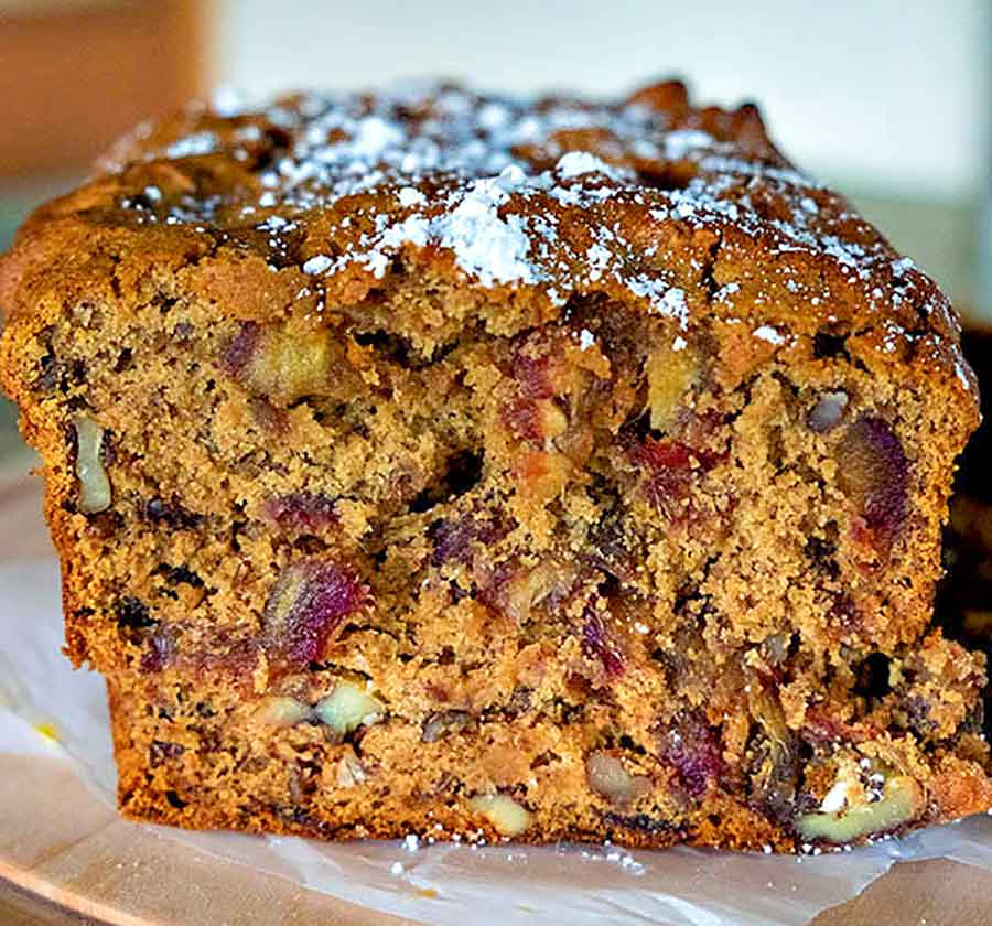 a cross section of sliced walnut date loaf