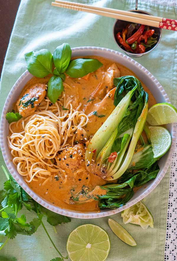 creamy thai chicken with noodles in a bowl