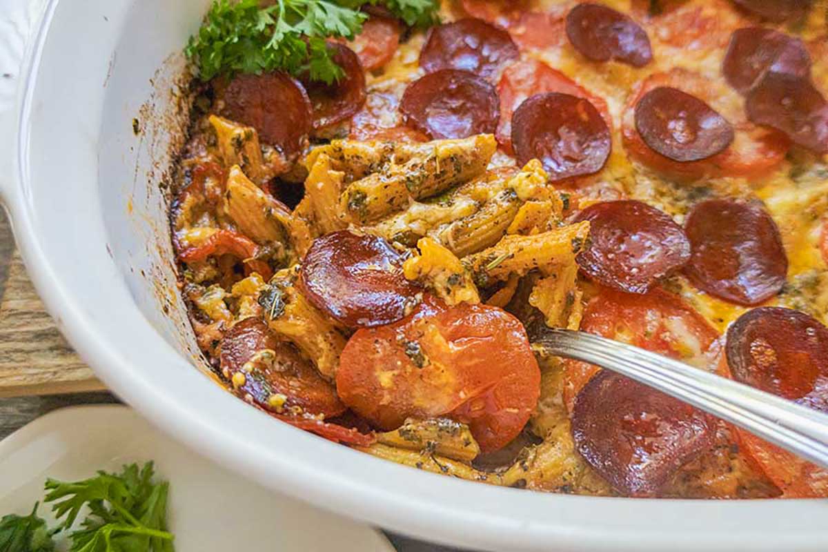 freshly baked Gluten-Free Pizza Pasta Bake with Pepperoni in a light tomato pizza sauce, melted cheese and crispy pepperoni