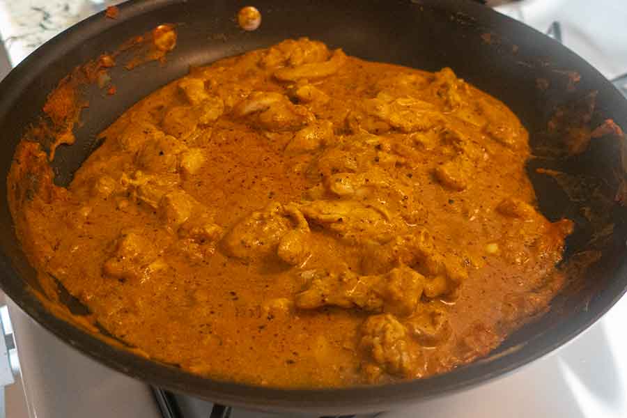 butter chicken pieces in a skillet