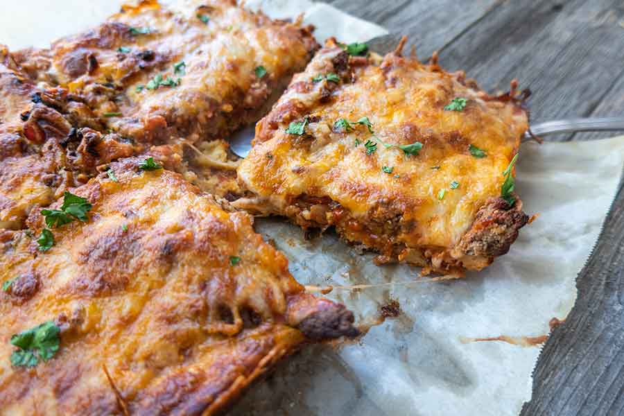 crazy crust pizza sliced into squares for game day