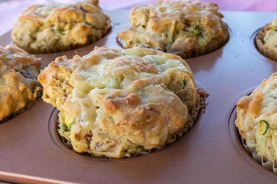 bacon and zucchini cheese muffin in a muffin pan