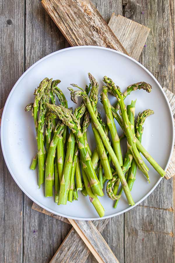 raw asparagus on a plate