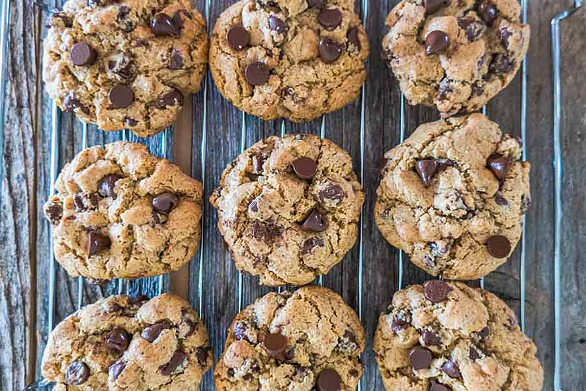 freshly baked brown butter crispy chocolate chip cookie cooling on a cooling rack