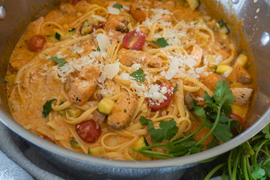 creamy salmon pasta in a saucepan