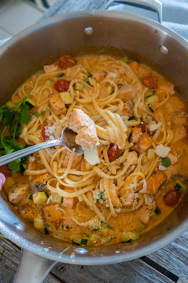 30 minute weekend recipes include creamy salmon pasta in a saucepan.