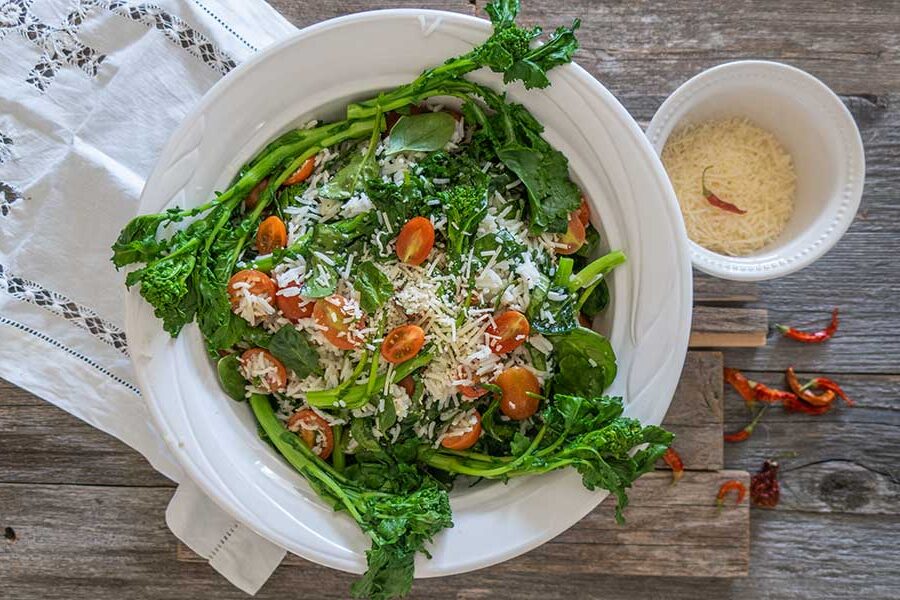 mediterranean rice with spinach in a bowl