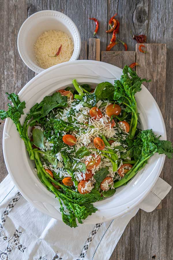 mediterranean rice with spinach in a bowl