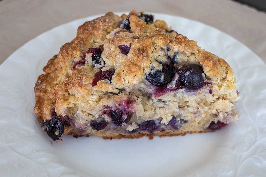 zesty blueberry scone on a plate, gluten free