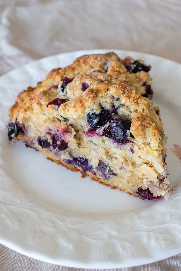 slice of blueberry scone on a plate