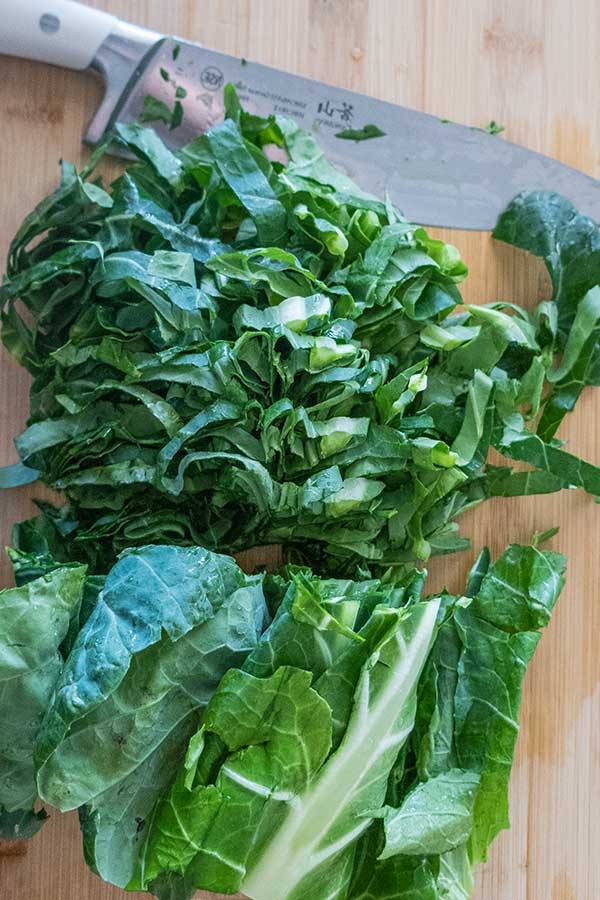 sliced collard greens on a cutting board