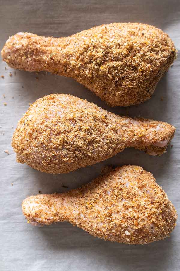 3 chicken pieces coated with shake and bake crumbs