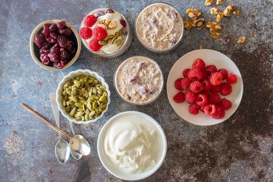 ingredients in cups for cranberry walnut overnight oats