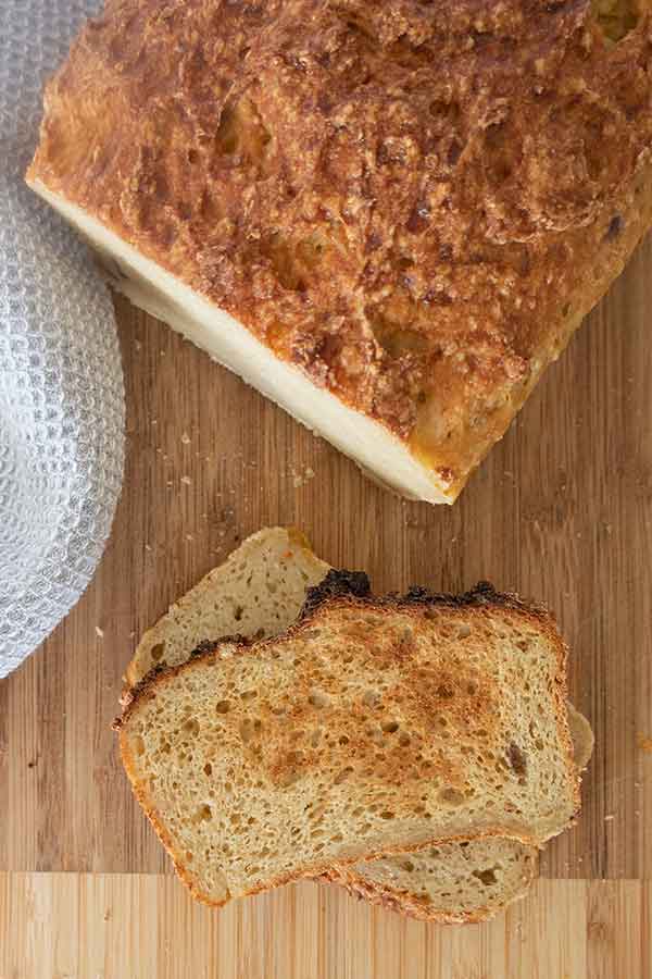 sliced millet bread on a wooden board