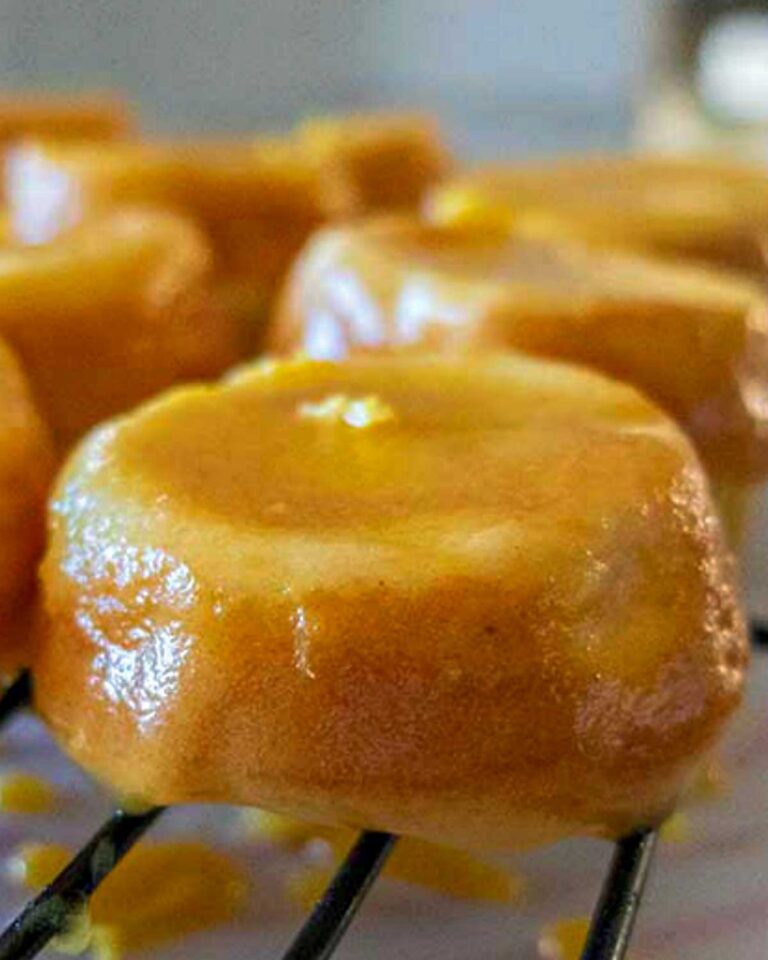 close up of gluten free mini lemon cake topped with lemon glaze