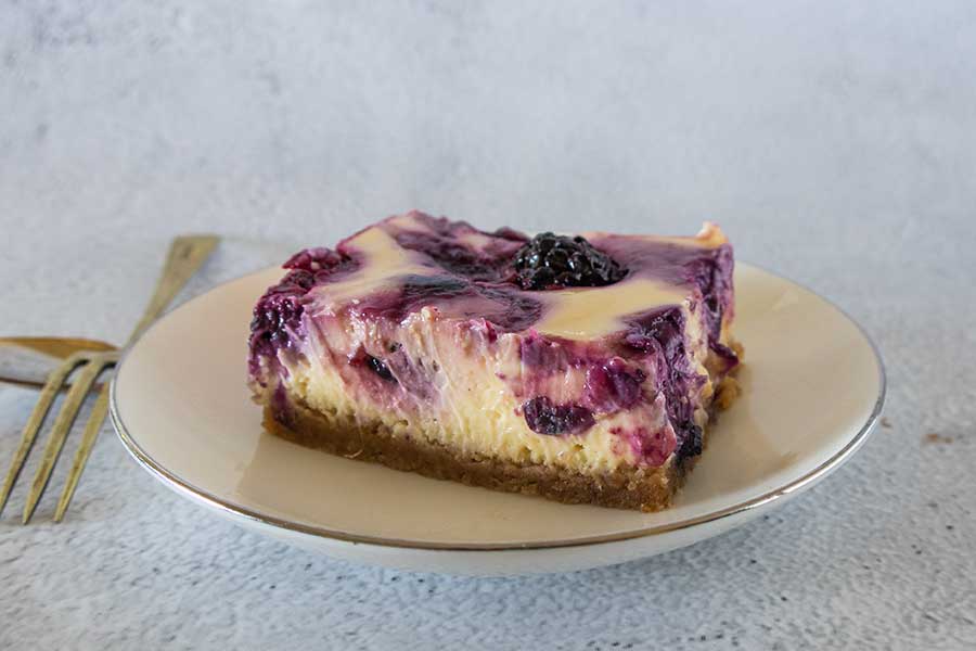 slice of grain free berry cheesecake bar