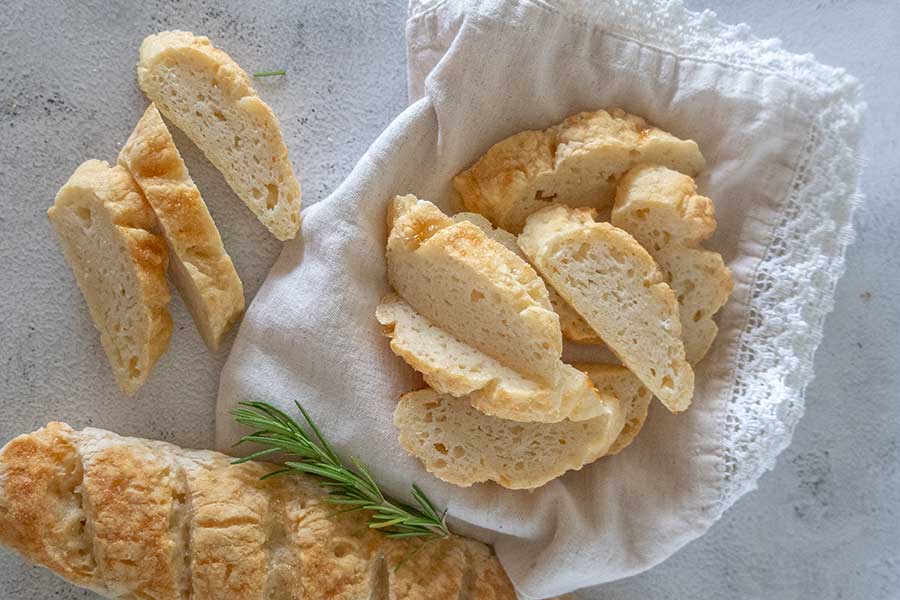 sliced gluten free italian bread in a basket