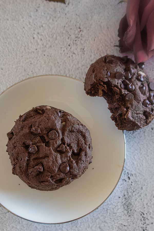 2 fudgy brownie cookies on a dessert plate