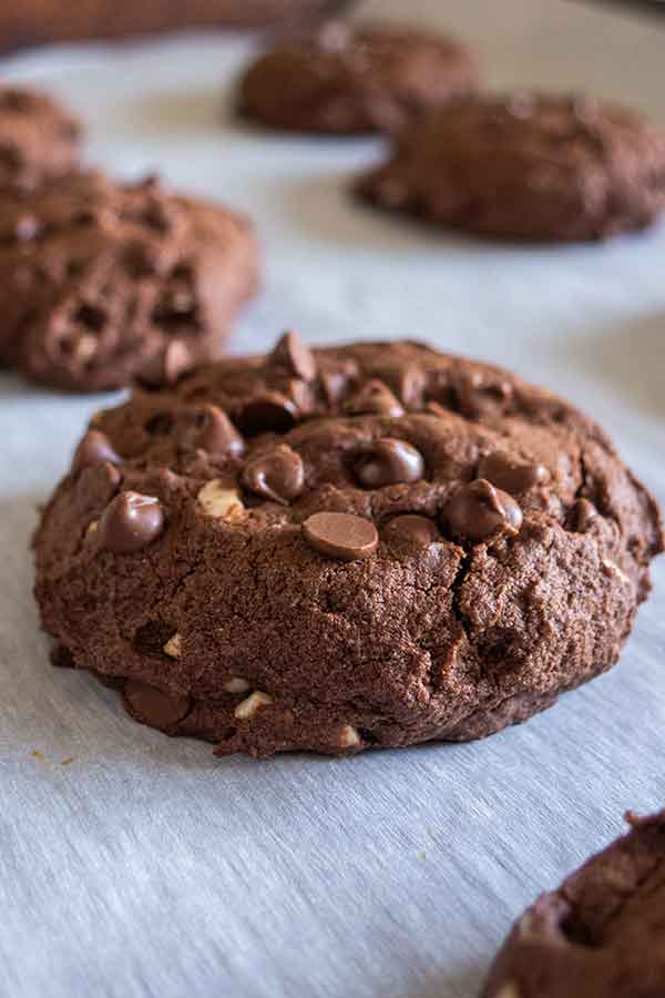 1 baked fudgy brownie cookie on a cookie sheet