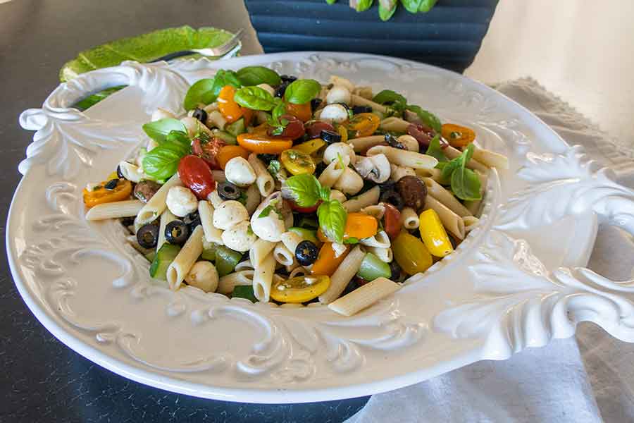 mediterranean pasta salad in a white bowl