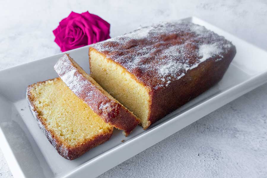 sliced rice flour pound cake on a platter, gluten free