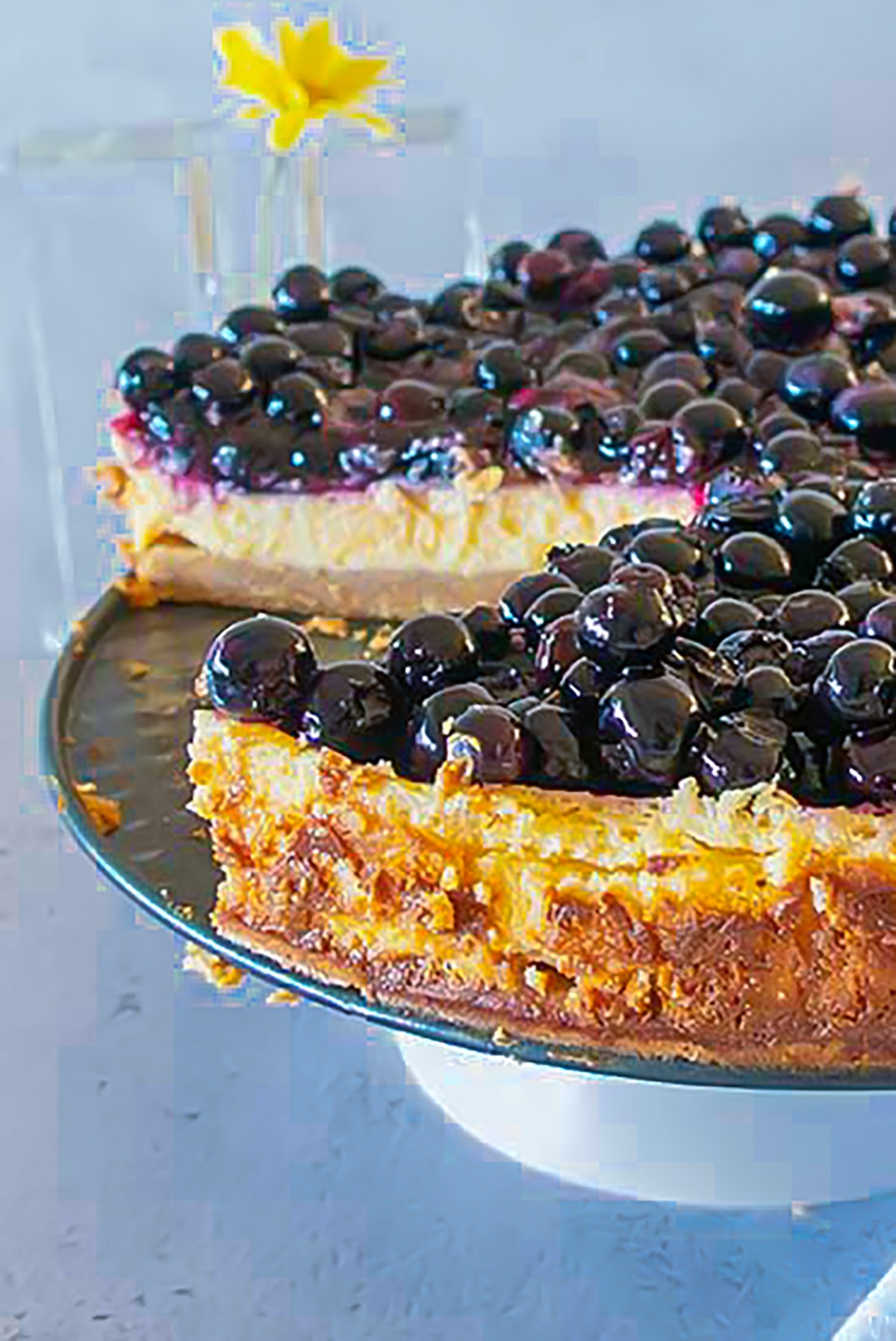 whole blueberry key lime cake on a platter