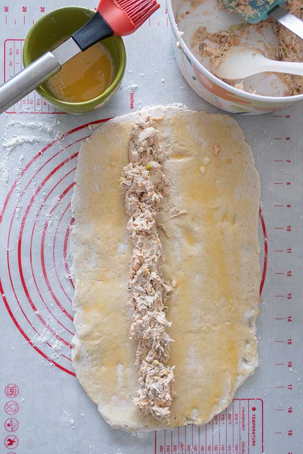 buffalo chicken filling spread over dough