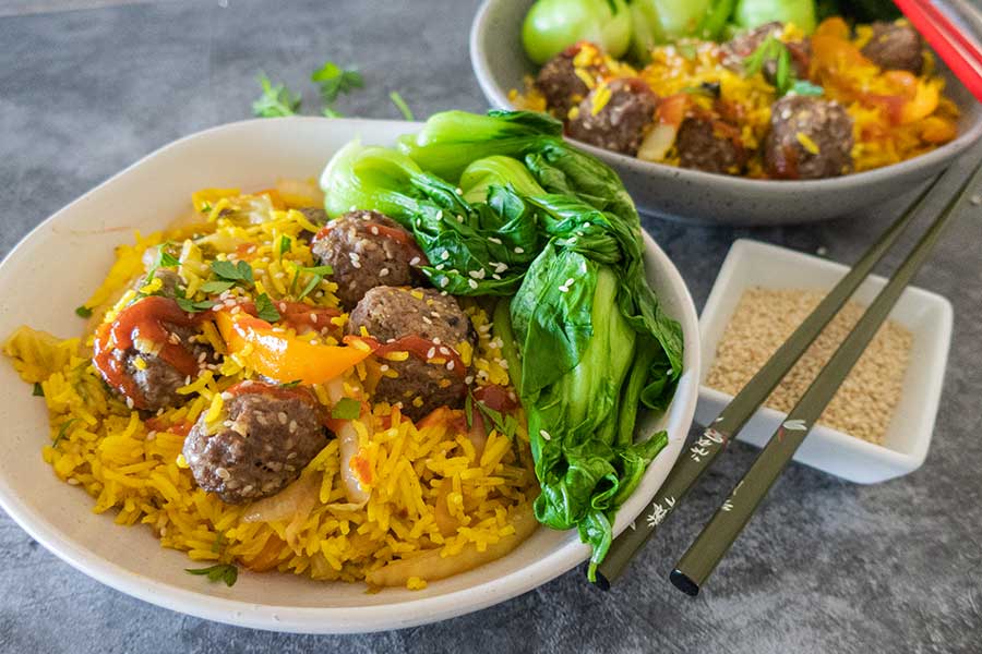 firecracker rice bowl, meatballs, veggies and ricce in a bowl