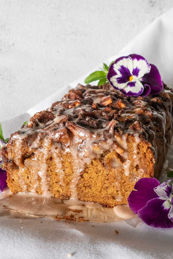 apple fritter bread with a glaze and flowers