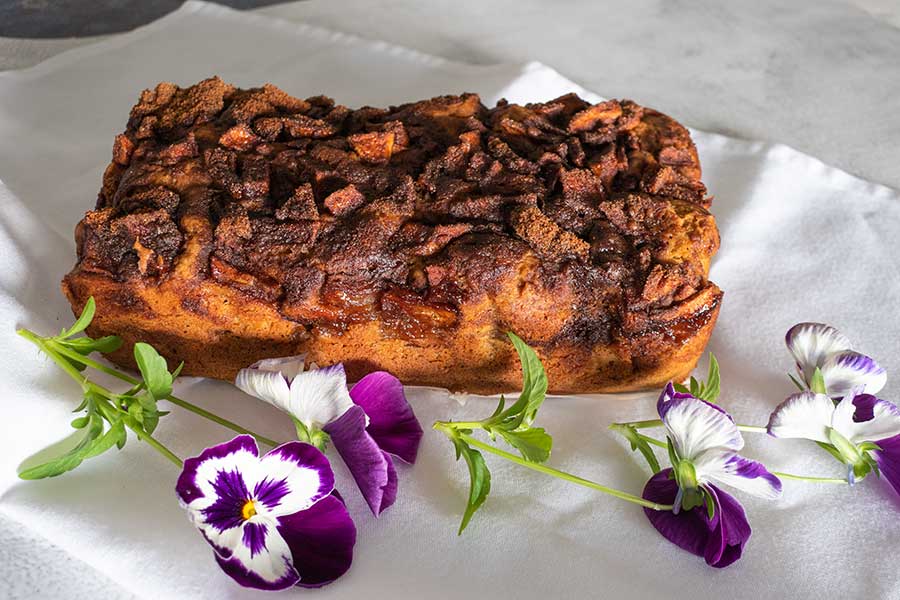 baked gluten-free apple fritter bread decorated with flower