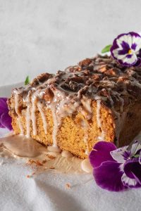gluten free apple fritter bread loaf drizzled with cinnamon glaze