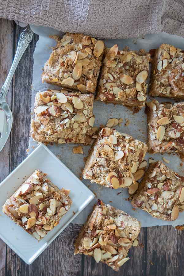 slices of gluten free apple pie bars, one is on a plate
