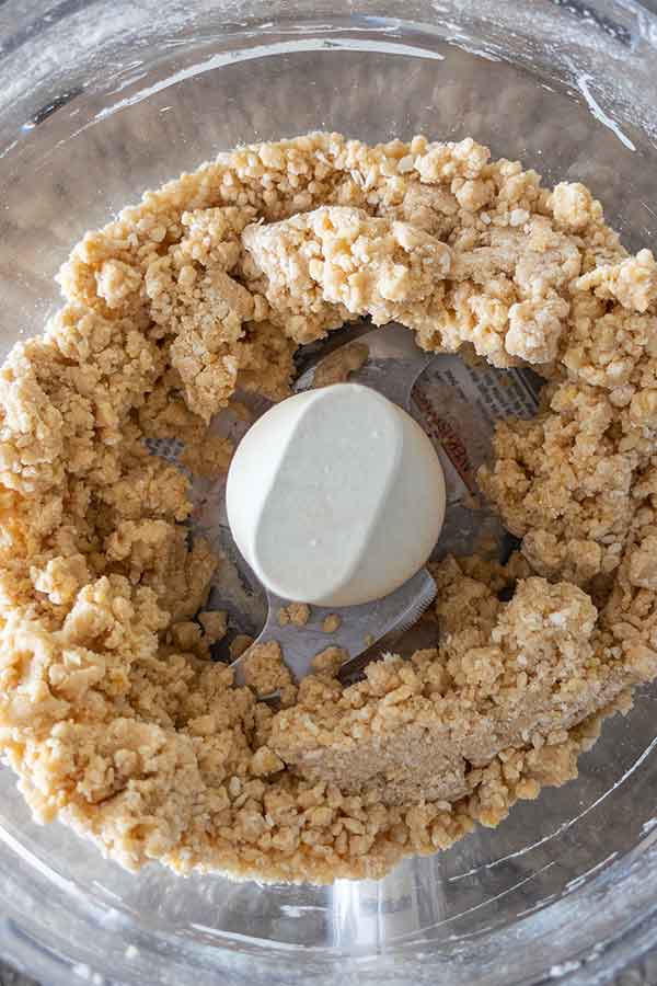 apple pie dough pulsed in a food processor