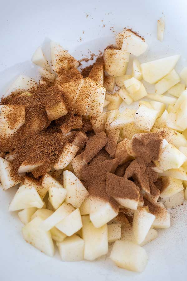 sliced apples topped with cinnamon sugar