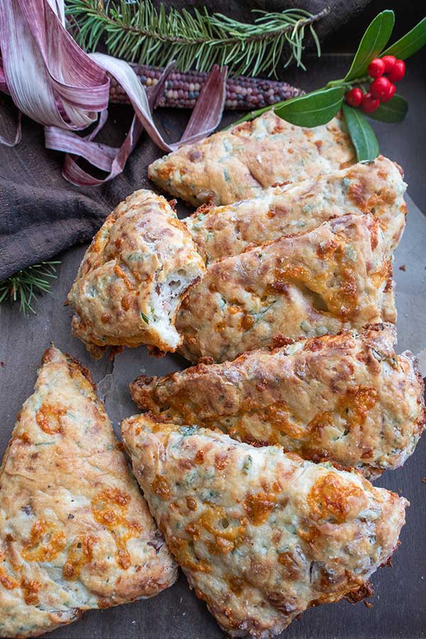 7 bacon and cheese triangle scones on a platter