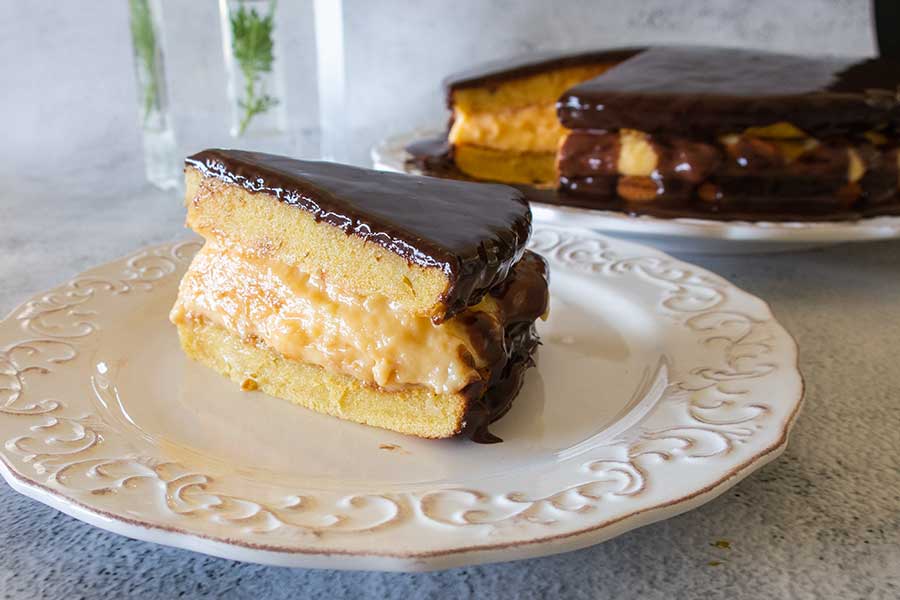 slice of boston cream pie on a plate, gluten free