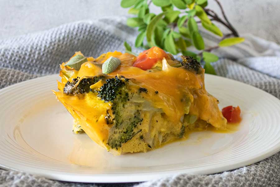 slice of broccoli cheddar pie on a plate, vegetarian