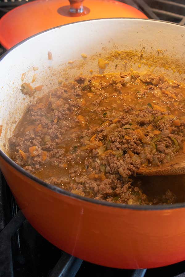 hamburger helper sauce simmering in a pot