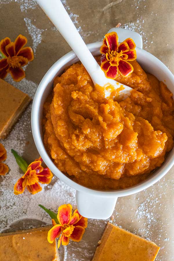 pumpkin puree in a cup with a spoon